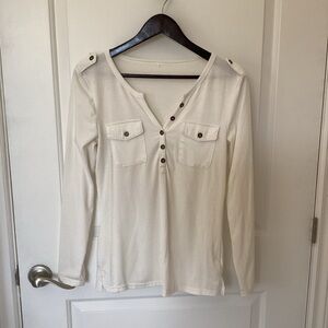 White Henley long sleeve shirt.